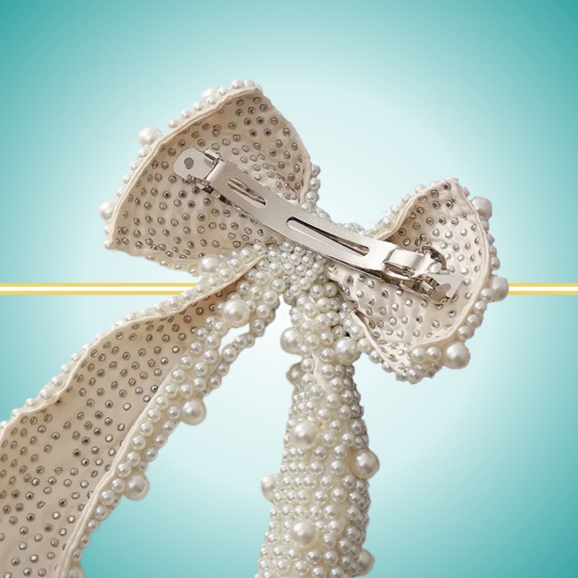 Elegant long white bow hair clip adorned with delicate pearl embellishments, perfect for special occasions or everyday wear.