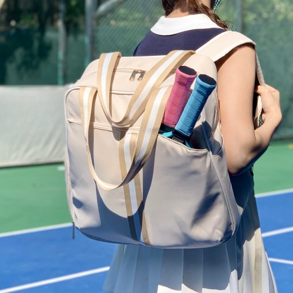 pickleball backpack featuring dedicated shoe compartment and convenient two-paddle capacity cover in front pocket beige