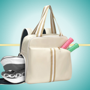 pickleball backpack featuring dedicated shoe compartment and convenient two-paddle capacity cover in front pocket beige