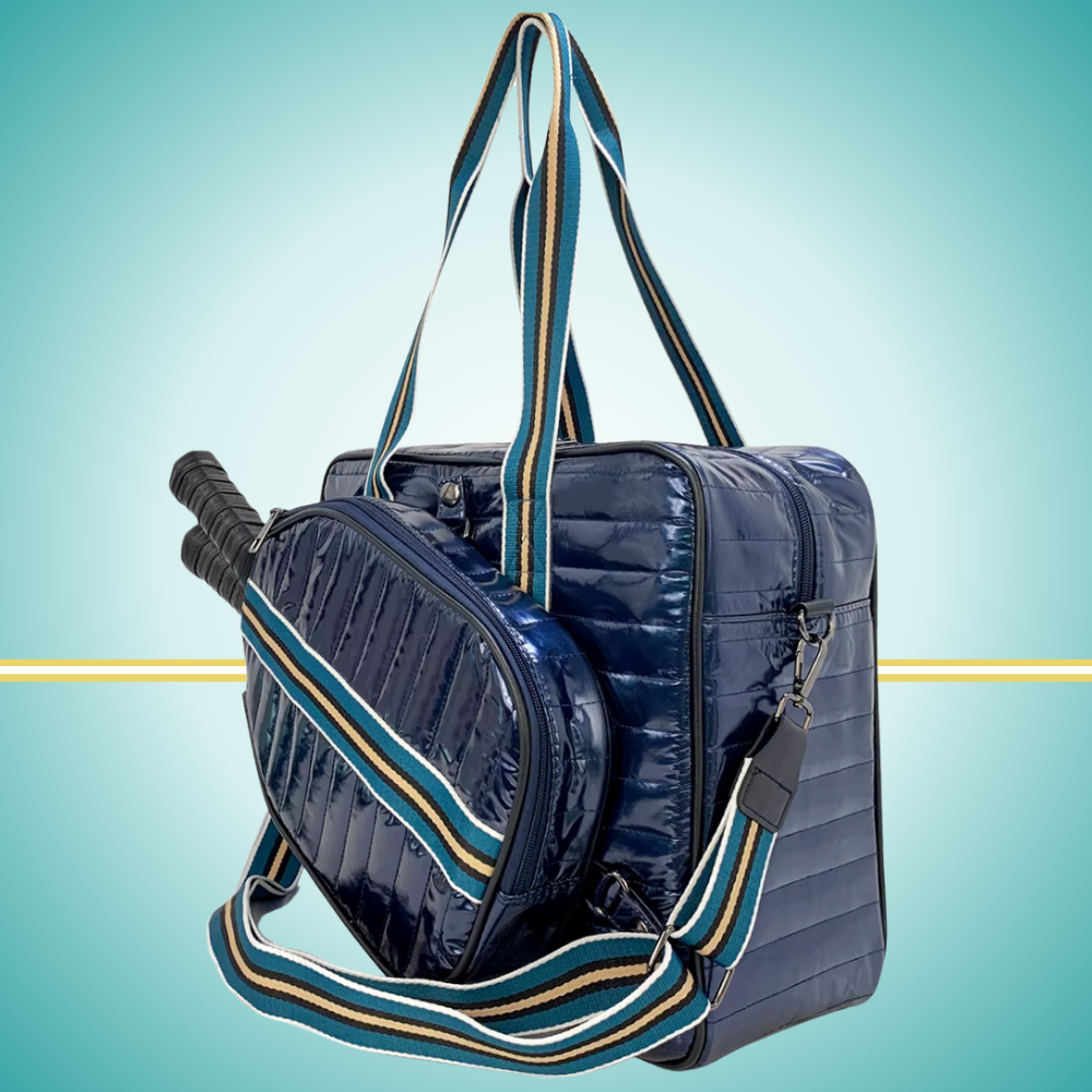Luxury pickleball puffer tote bag with innovative 2-in-1 design - detachable paddle cover connects with adjustable strap to transform into crossbody bag while main tote holds gear navy
