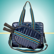 Luxury pickleball puffer tote bag with innovative 2-in-1 design - detachable paddle cover connects with adjustable strap to transform into crossbody bag while main tote holds gear navy