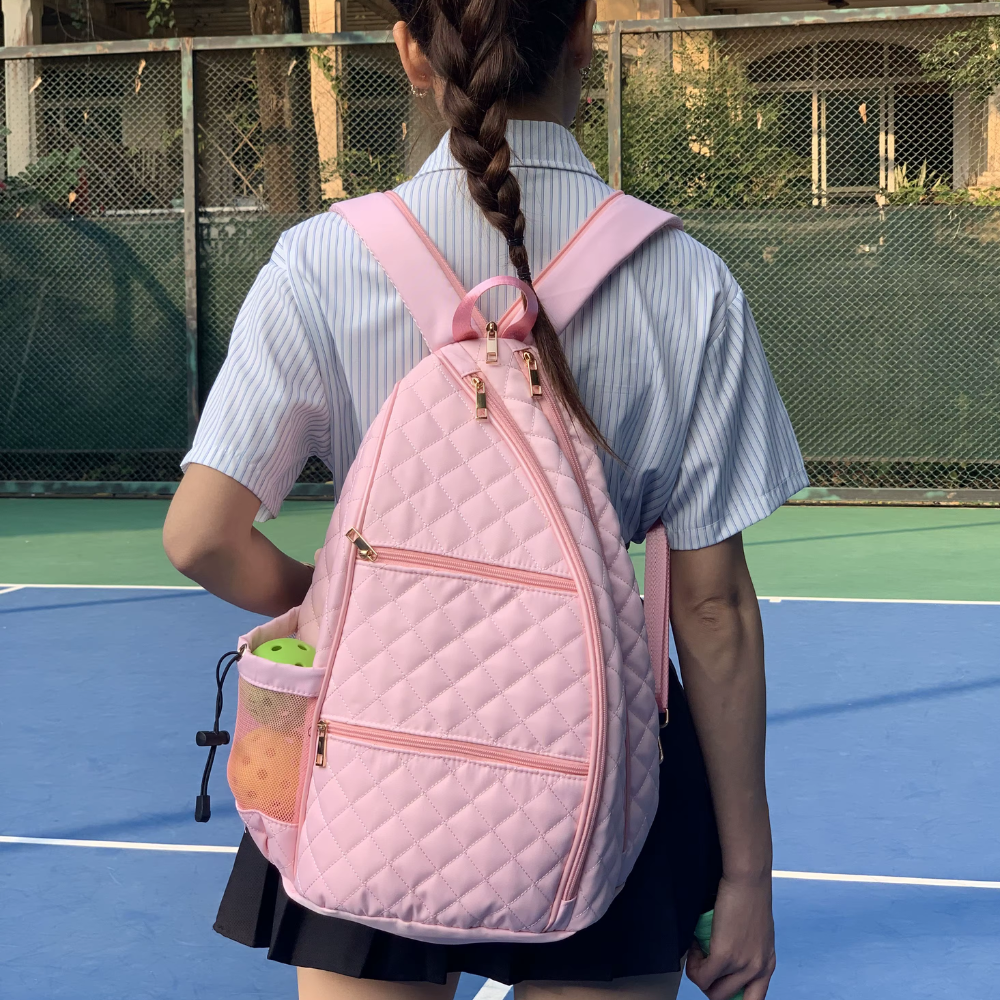 Pink puffer tennis convertible backpack for women with zipper transformation system - easily converts to sling bag while maintaining two-racket storage capacity pink