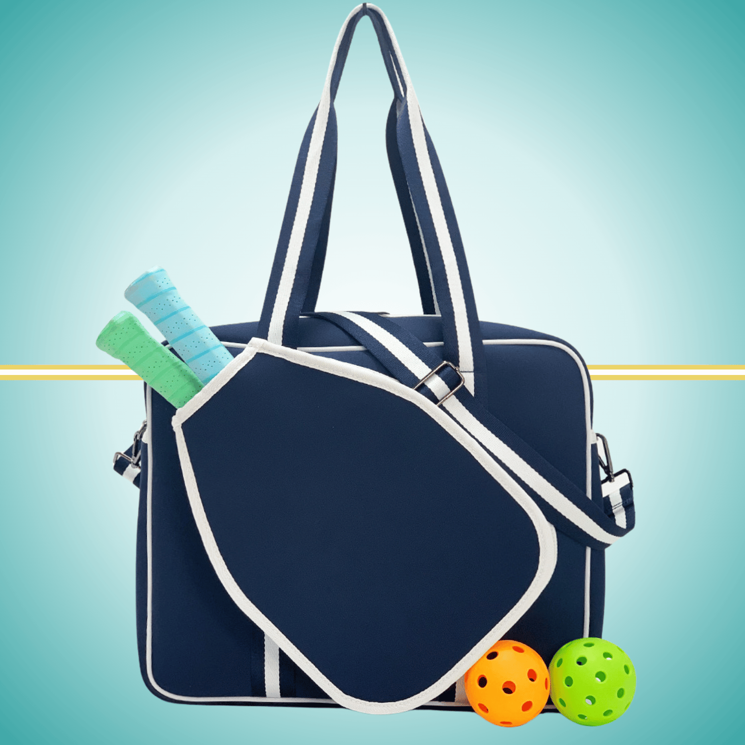 Navy women's pickleball tote bag with  white stripes, top handles, adjustable crossbody strap, and attached front paddle cover.